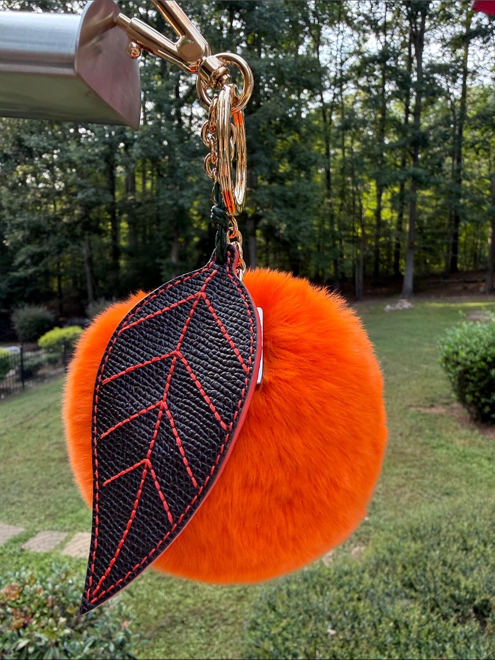 Dolce & Gabbana Orange Mink Fur Pom-Pom Keychain with Black Leaf Accent